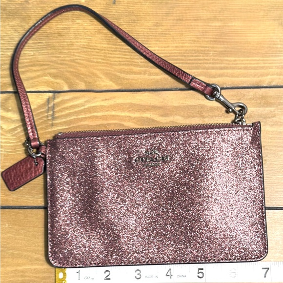 Coach Handbags - Coach Sparkling Wristlet in purple wine color EUC